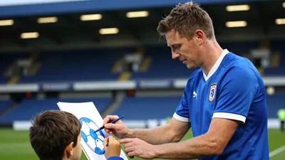 Ipswich Town young fans participate in a football-themed creative workshop at Portman Road stadium, combining literacy...